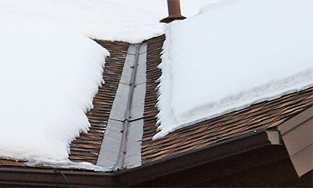 A roof heating system installed in valleys and roof eaves.