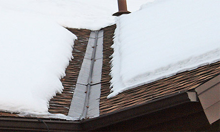 A roof de-icing system installed in roof valley and eaves. A roof heating system installed in valleys and roof eaves.